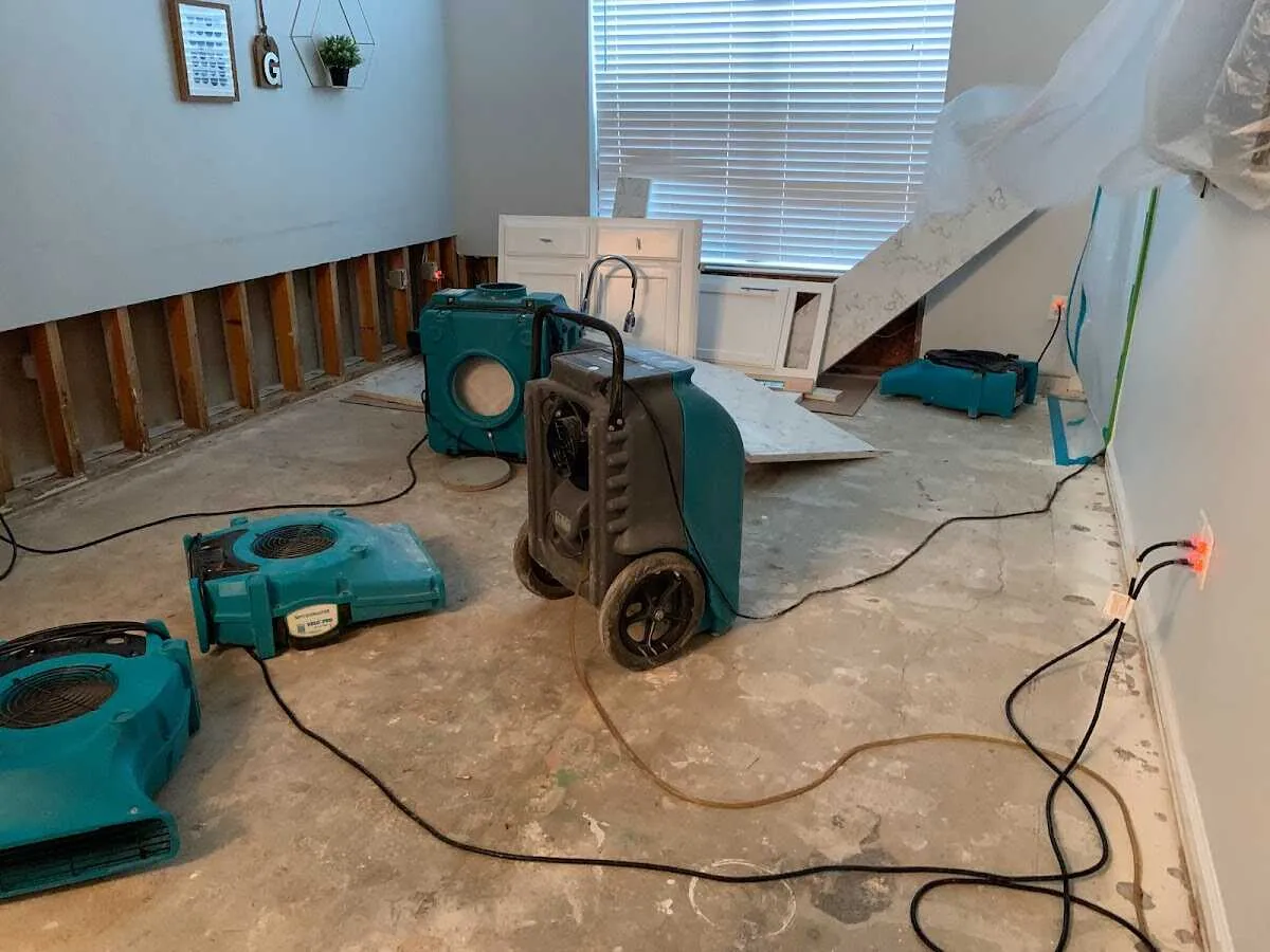 Dehumidifier in flood-cut room for Water Damage Restoration in California